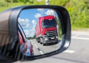 truck reflected in car mirror passenger car accidents weight of truck semitruck
